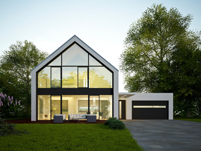 Einfamilienhaus mit Garage in Abendstimmung zum Thema Sachwertfaktor